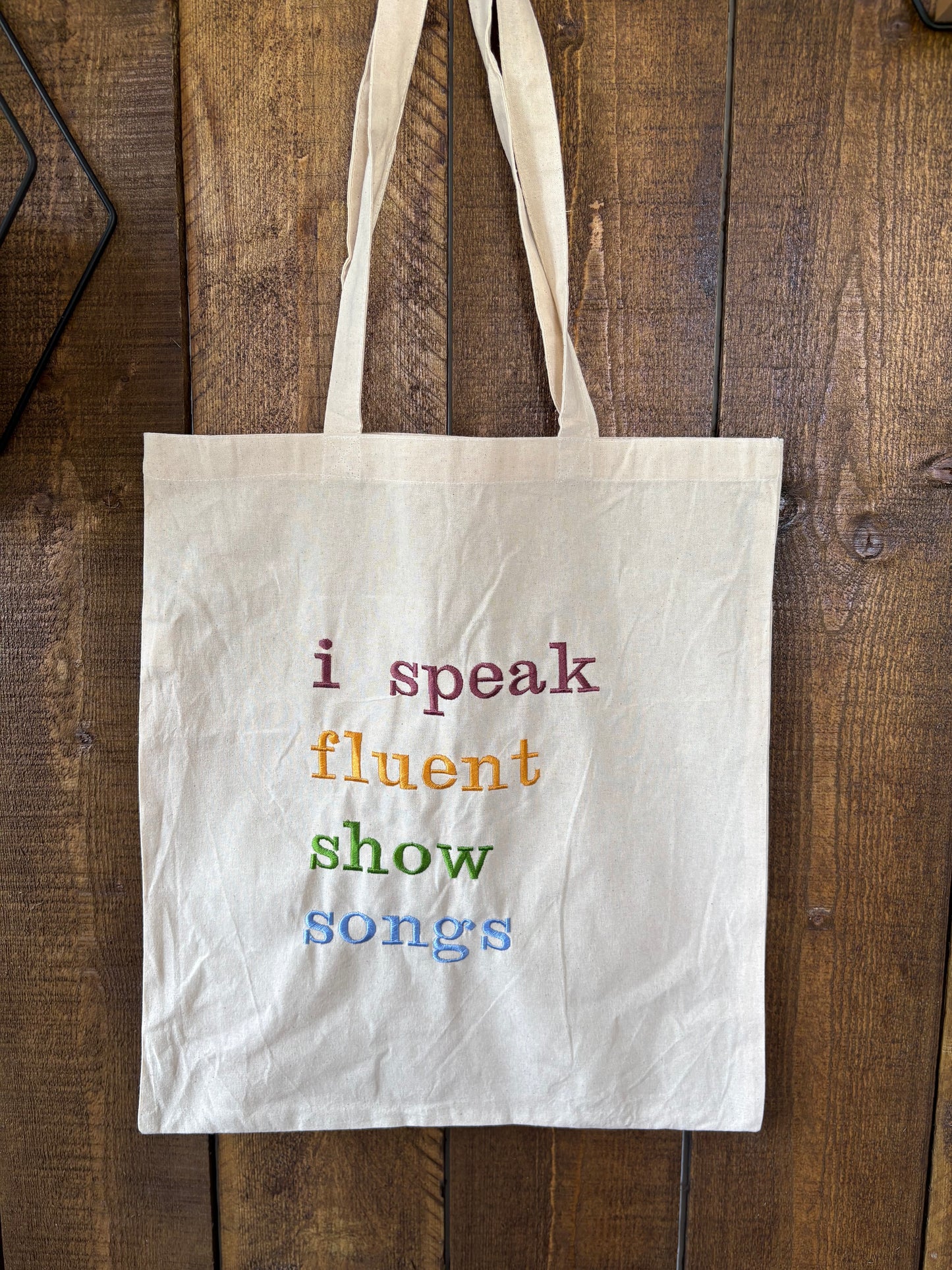 Embroidered statement tote bag